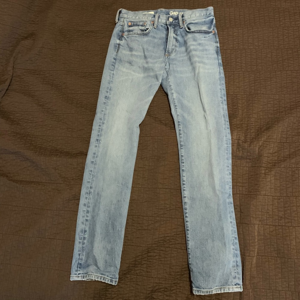 Faded light blue jeans